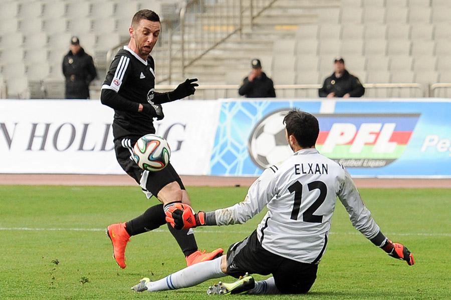 Muarem tries to chip the keeper