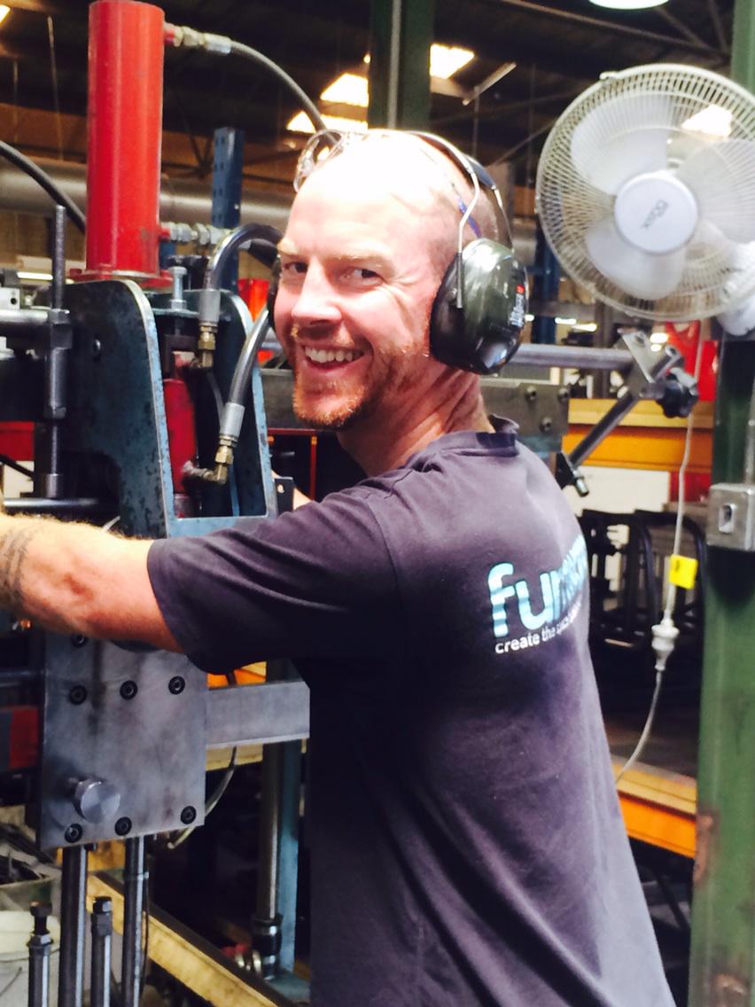 Furnware's tweet photo. Furnware people: JT gets bending machine ready for alpha desks. Gr8 quality control #thefurnwaredifference #lovemyjob http://t.co/YZigHrdDLc