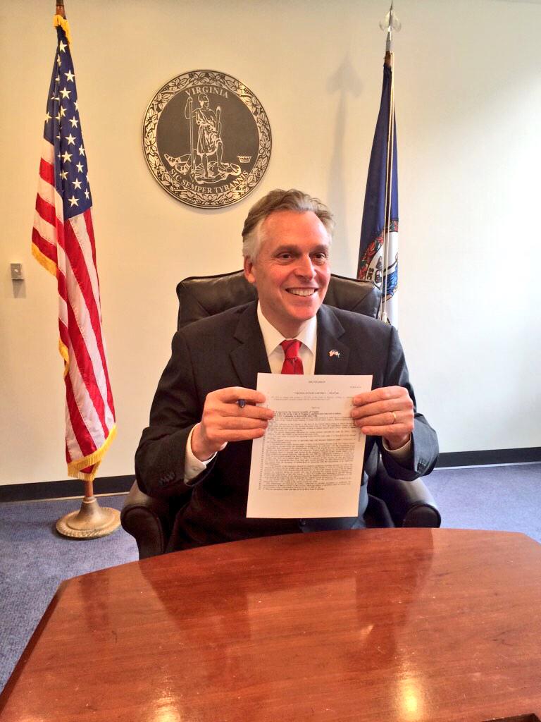 Governor McAuliffe signs his first bill of the 2015 session, SB1044 - the tax conformity bill.