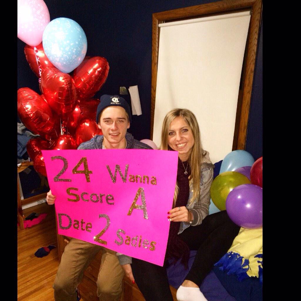 ChaskaChanHC's tweet photo. Senior Lauren Hanson asks boyf Tanner Stolt w a nice sign! Not sure what the balloons are for but you go girl!! 🎈🔮💝 http://t.co/mP8g4eeuLt