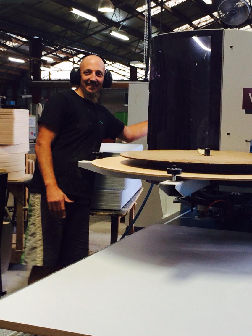 Furnware's tweet photo. Our man Shane in Panel Dept, checks quality of all edge tape on surfaces. #furnwarepeople #thefurnwaredifference http://t.co/HEQmxxTmvy