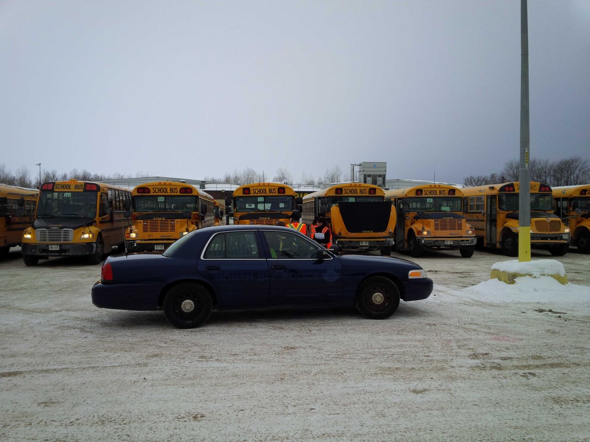 NorthBayPolice's tweet image. We're getting ready for #rememberadam #stopforschoolbus commemoration at Pete Palangio. Close to 20 buses here.