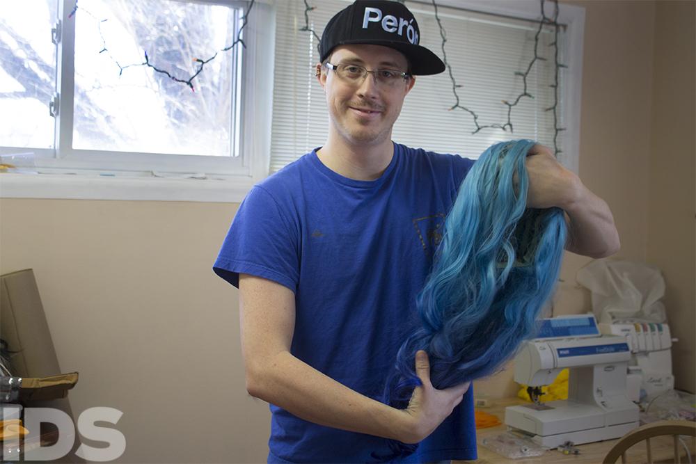 Christopher Simanton holds the wig he will wear for the Condom Fashion Show Thursday at the IMU. By: @NicoleKrasean
