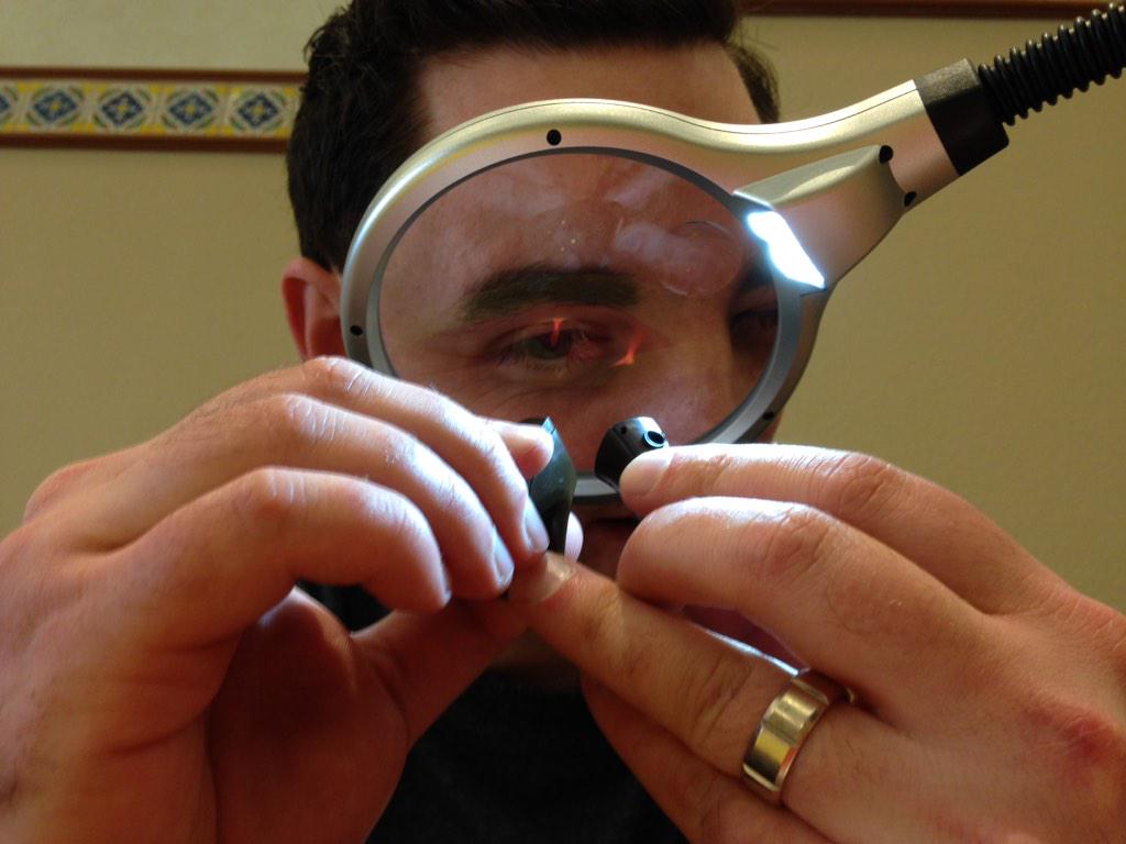 CochlearUS's tweet image. Chris M., head of service and repair, doing an inspection of a processor! #Cochlear2015 #CleanandCheck