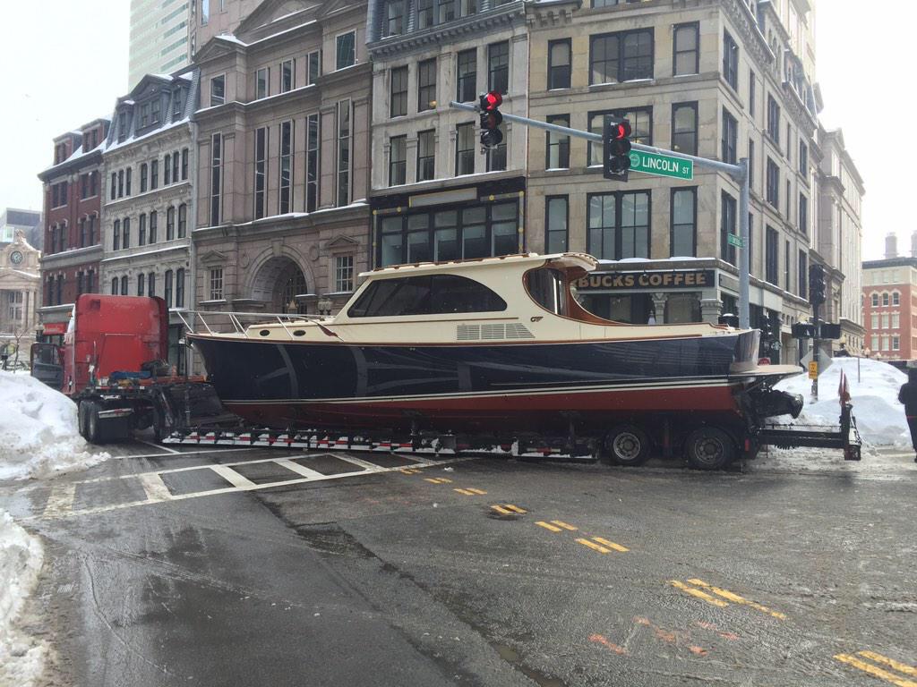BostonTweet's tweet photo. There's a boat stuck in the snow on Summer Street in Downtown Crossing. Say what?! (pic @dhack21) http://t.co/NoPb70dFQK