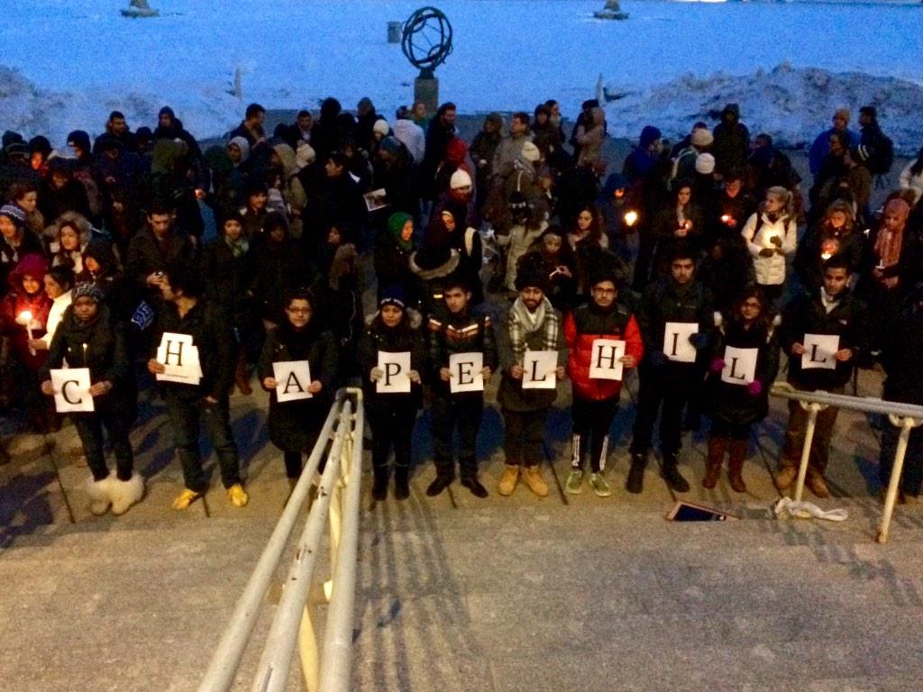 waiss_aramesh's tweet photo. Students standing in solidarity with Chapel Hill at the vigil earlier this evening. http://t.co/44SnMaBwoX