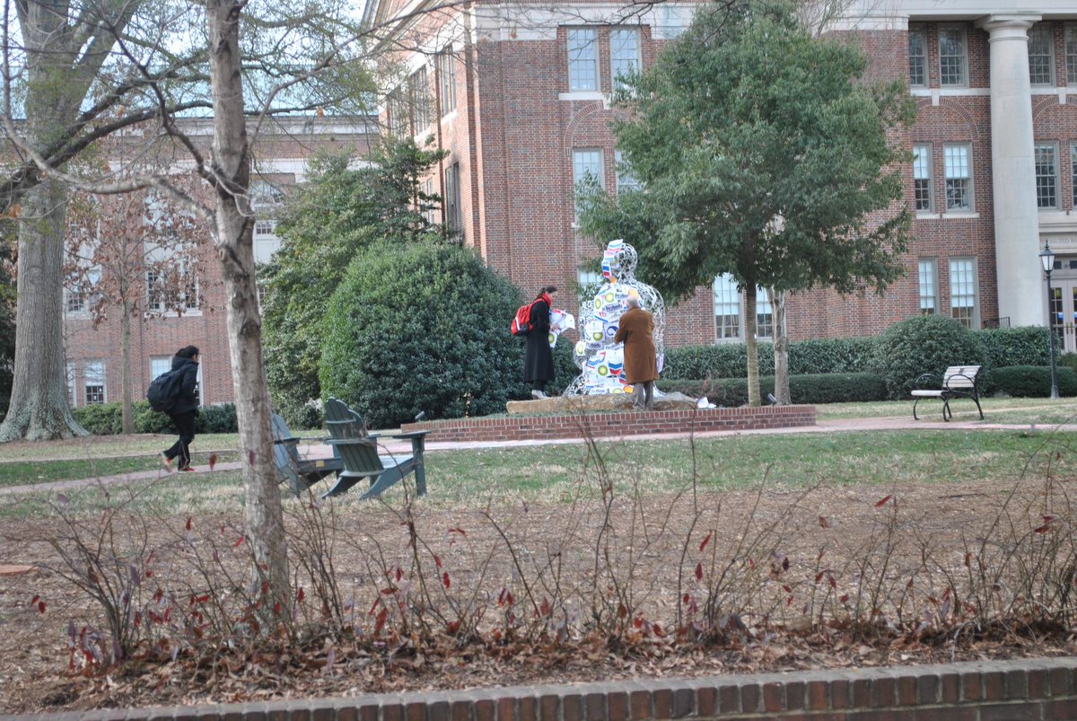 We hate "profit over people" &amp; <a href="/DavidsonCollege/">Davidson College</a> prez @carolquillen does too! Here she defaces fossil fuel corp logos!