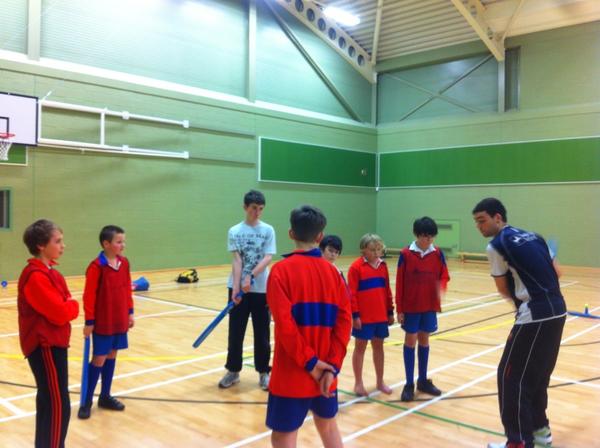 The year 7 and 8 boys receiving expert batting tuition from Max Stokoe