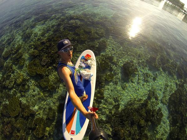 Photo of the Day! Gold star to Markus Lahmer for helping keep the ocean trash free. Go Markus! #GoPro #SUP #Maldives