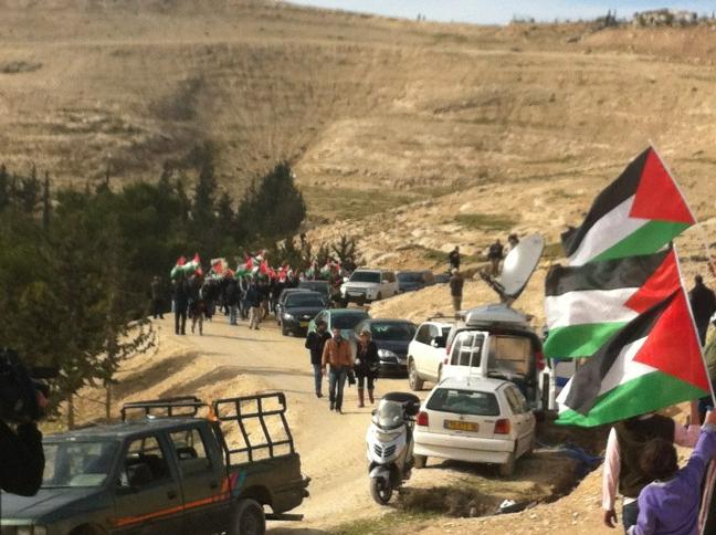 Palestinians arrive in Bab Al-Shams by foot, to avoid roadblocks Palestinians arrive in Bab Al-Shams by foot, to avoid roadblocks