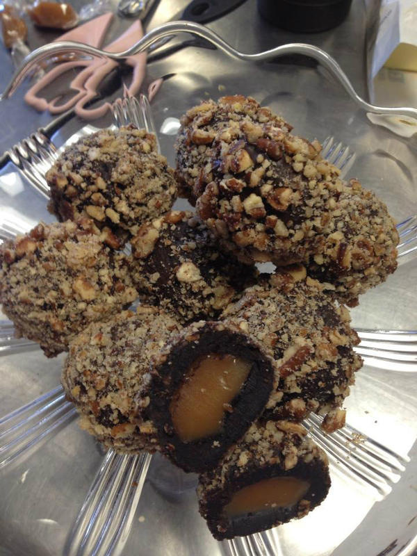 SWPastry's tweet image. Flourless chocolate cake filled with caramel, rolled in cocoa and nuts with a hint of cayenne. What to call them? Hmm