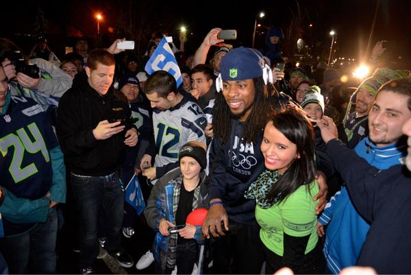 Seahawks's tweet photo. .@RSherman_25 came directly off the bus and into the crowd at VMAC. Pic by @rodmarphoto http://t.co/yYlzPtWT