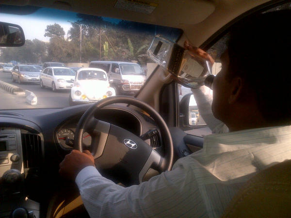 ravibopara's tweet photo. Our driver is knocking back black label on the job. Hahahahahaha. #dhaka #bplt20 http://t.co/JXLgF2aI