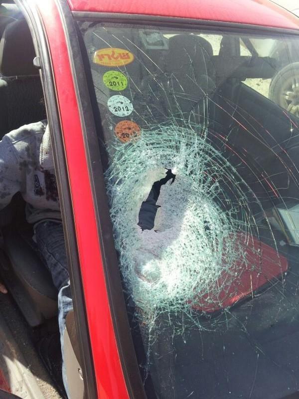 IDF's tweet image. Palestinians threw rocks at this car today, wounding Israeli boy in front seat. Rocks can kill. RT so everybody knows.