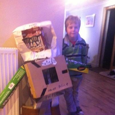 Makedo's tweet image. 7 year old Gregor from Scotland standing proudly by his partner &apos;Police Robot XO-D5&apos;. #Makedo #robotpolice