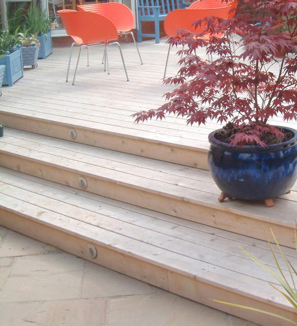 Nice cedar deck with stainless steel eyelid lights in the steps.