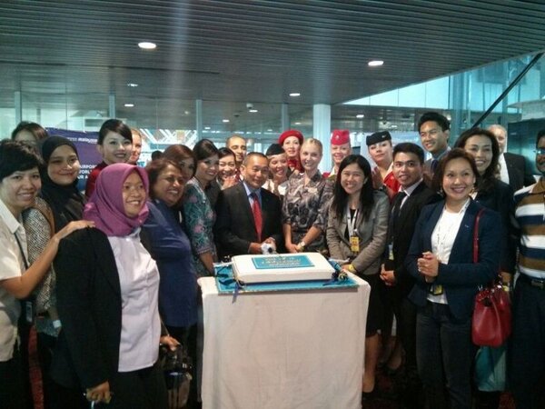 MAS's tweet photo. And our new oneworld-liveried A330 is off! Here's AJ and the crew celebrating with a yummy #MHoneworld cake! http://t.co/44DJbYQe