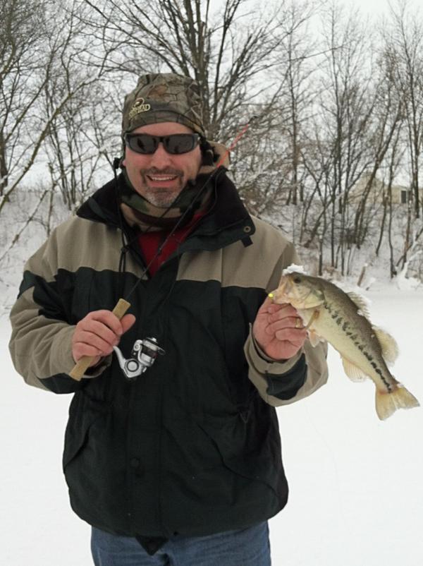 First fish of 2013..Ice fishing, every once in a while it qualifies as FUN. #not2cold #nowind #caughtfish