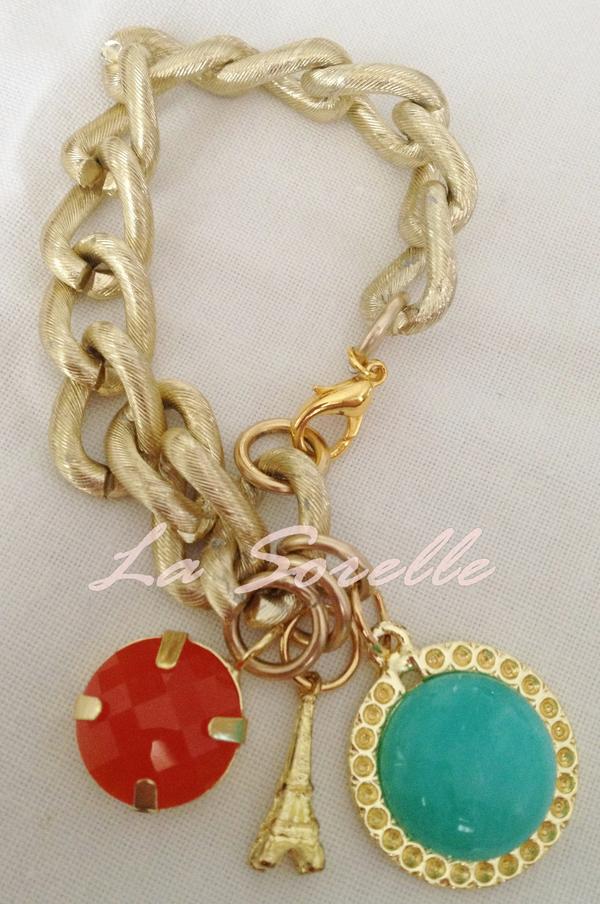 LaSorelle's tweet photo. Pulseiras com pingente: turquesa, laranja e torre eiffel. http://t.co/20jFTPs6