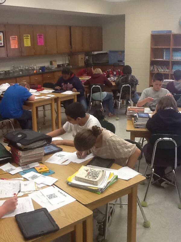 SMS students using iPads to learn about the rock cycle.