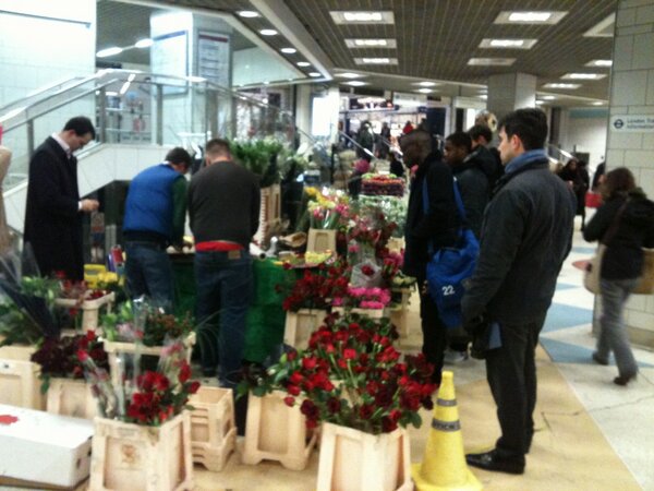 Meek queues for red roses at Liverpool Street. Rather sweet.