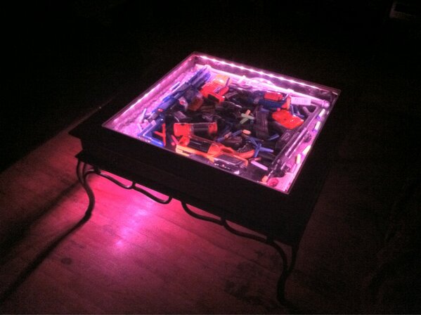 grumpyoldgreg's tweet image. Waitin fer the ol&apos; lady to git off work. Til then, settin with my nerf gun coffee table display case #nerf