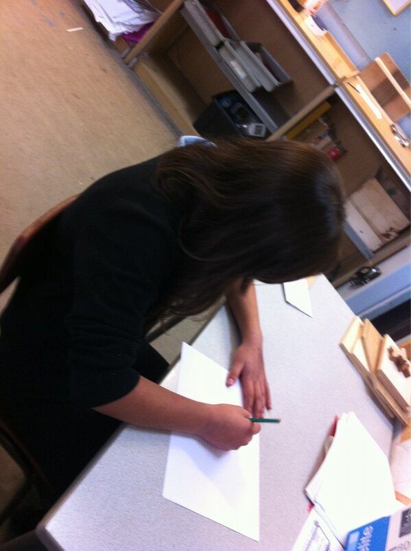 TeamAttack1's tweet image. Ania sketching merchandise designs