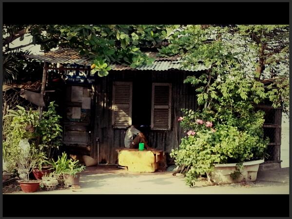 genochio's tweet photo. country shack slap-bang in the middle of #HCMC. #saigon #photo Shared via #Fotor http://t.co/2W0eWv2N2i