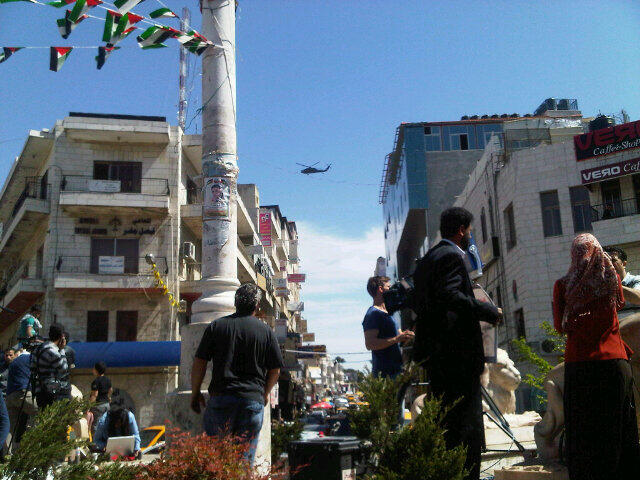 American helicopter - perhaps the one carrying Obama - flying over Ramallah's Manara Square