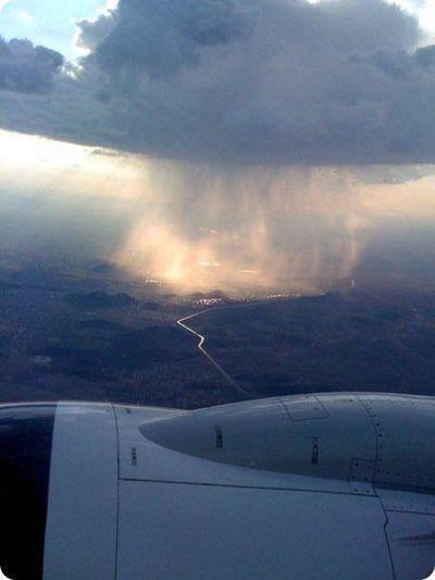 WeFly's tweet photo. A view of rain falling in the distance #WeFly Enter our #Competition! Win 2 tickets to Dubai: http://t.co/SDUtJcAhHG http://t.co/hBL9cDPUez
