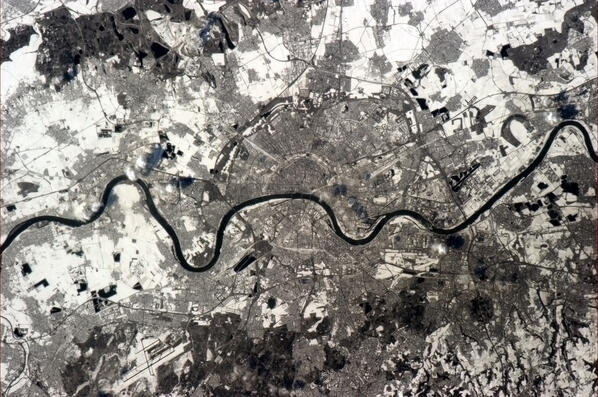 Cmdr_Hadfield's tweet photo. Köln (Cologne), Germany. The old city street patterns fanning from the Rhine, visible from space. http://t.co/TATHciCef7