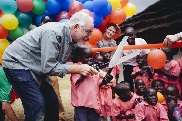 bobgoff's tweet photo. Heaven's leaning over the rails waiting to welcome each of us. Ribbon cutting at Restore’s next school http://t.co/jSYfnftgRL