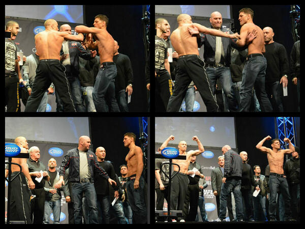 ufc's tweet photo. #UFC158 main event weigh-in staredown shots, featuring Dana regulating with the double underhooks http://t.co/ONEjd93HLw