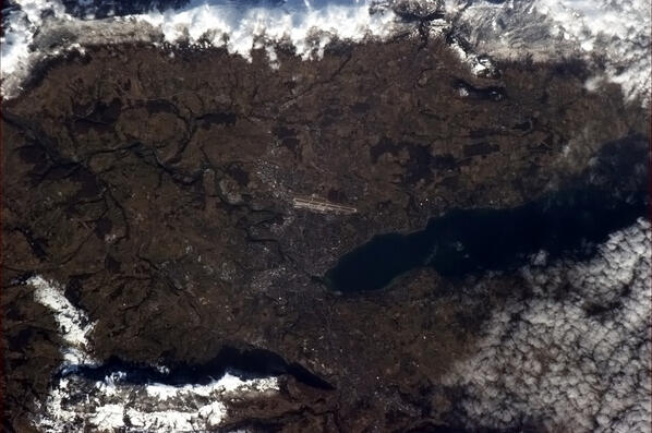 Geneva, Switzerland. Under that rock is the incredible CERN particle accelerator. Their AMS is mounted on Station.