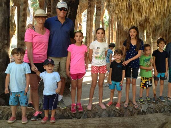 Matt_Romney's tweet photo. @MittRomney and @AnnDRomney with a pile of grand kids in Palm Springs. http://t.co/oYHhSPXv5j