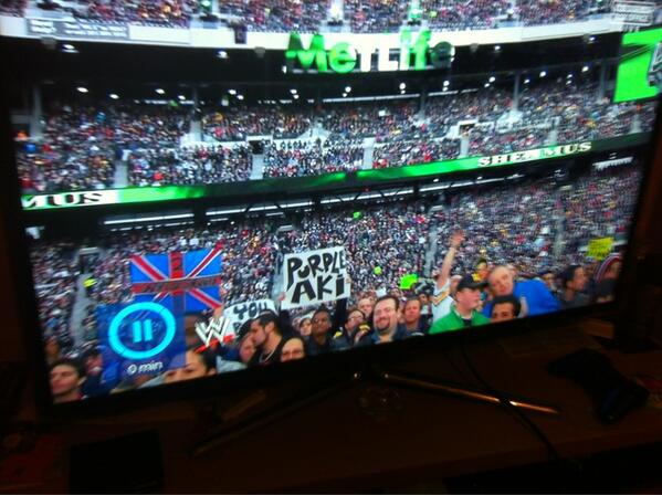 Houghton91's tweet photo. Purple Aki sign at Wrestlemania hahaha, quality! #wrestlemania #boots2asses #BestInTheWorld #KingofKings http://t.co/97lKSrWC41