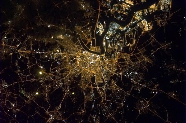 Cmdr_Hadfield's tweet photo. Antwerp, Belgium with the Scheldt river like lightning sparking up the city. http://t.co/T0Cw3d4YNG