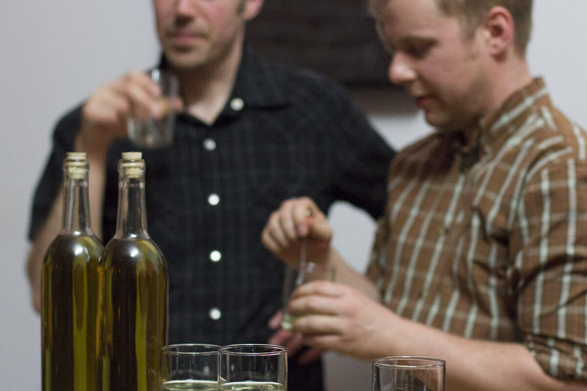 Jason Gowans & Michael Love taste-testing some moonshine at 221A. Photo: 221A.