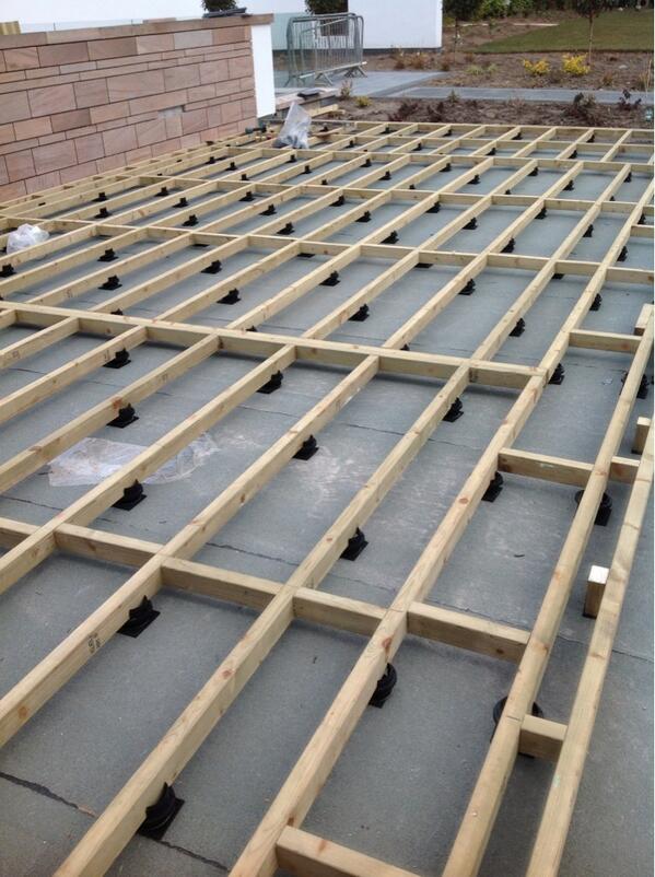 The deck sits over the top of the garage and the sponge based joist supports will protect the felt roof