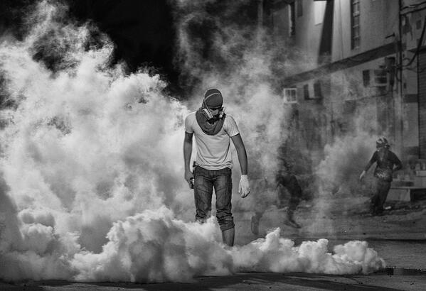 freedomhouse's tweet photo. 1st place winner in photo contest from #Bahrain: 'Political Participation &amp; Toxic Gas,' taken by Ahmed Al-Fardan http://t.co/oFBDlg217A