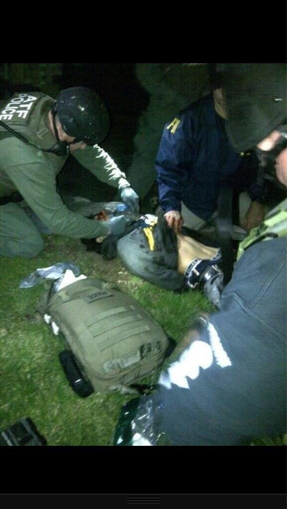 Fain_Train's tweet photo. The first photo of Jahar Tsarnaev being apprehended #USA http://t.co/Z5OK5FdCWo