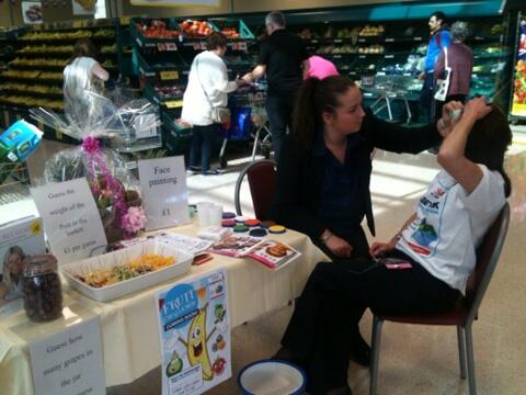 Lindsey practising her face painting skills before we let her loose on customers : )
