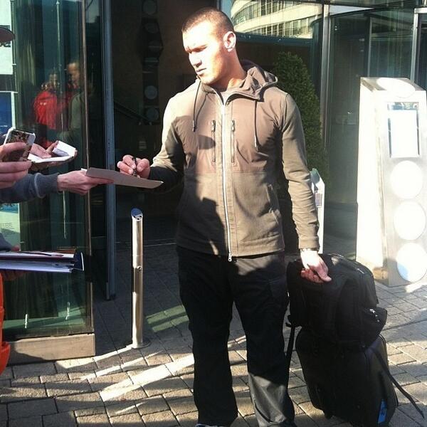 Randy Orton signing a couple autographs 