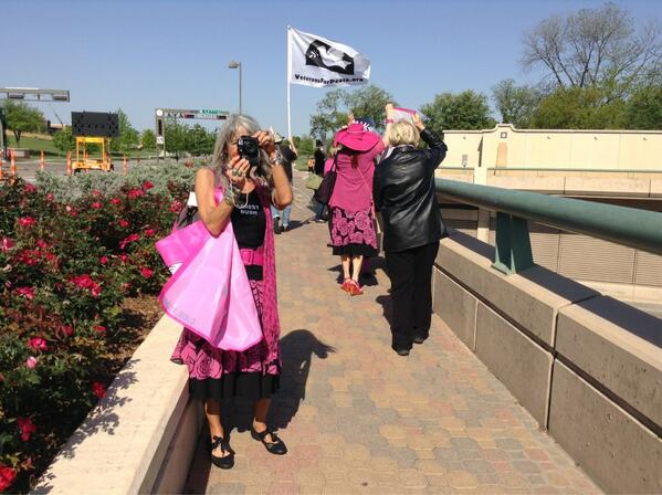 codepink's tweet photo. Carrying our @codepink banners across the freeway right near @TheBushCenter calling for SMU security to #ArrestBush! http://t.co/gDvVJLjWaT