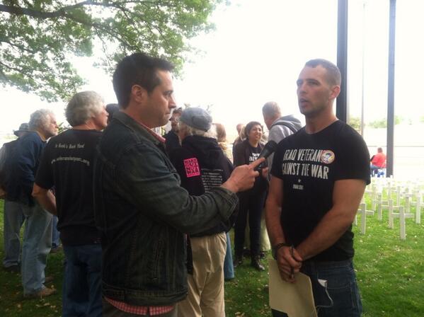 codepink's tweet photo. At the IVAW press conference @dennistrainorjr interviews active duty soldier Ryan Holleran #ArrestBush http://t.co/CdMyqZ9eej