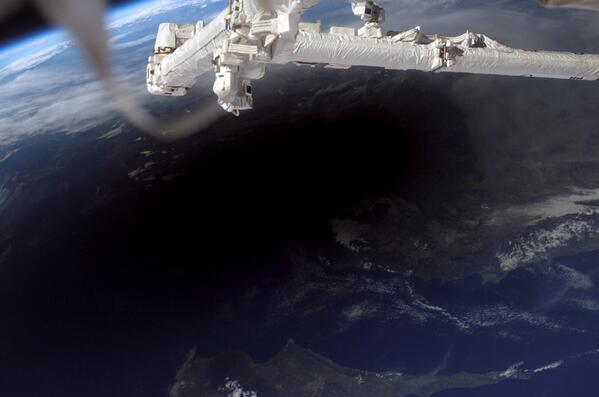Fascinating! This is what the shadow from a solar eclipse looks like from space