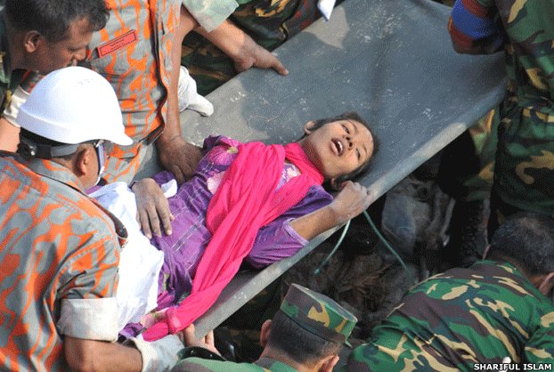 BBCBreaking's tweet photo. PICTURE: Woman pulled alive from rubble of Bangladesh factory after 17 days http://t.co/hWpkYkaamH http://t.co/SsSDeDZYGr