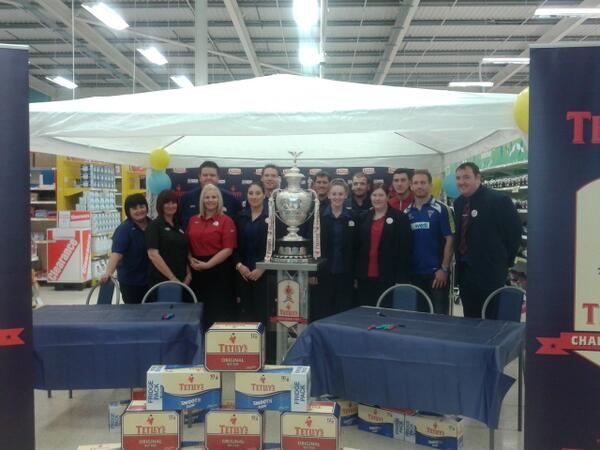 WarringtonRLFC's tweet photo. Tesco staff at the Warrington store pose for photo with @TetleysChCup trophy and Monaghan brothers. Come &amp; join us! http://t.co/iBy5weNS0v