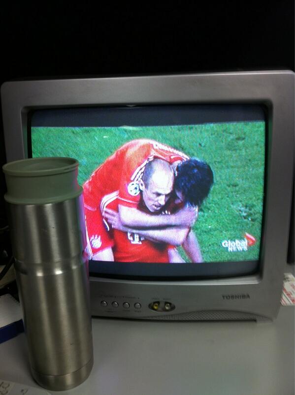 At work and this is the TV I get to watch the game on. I'm using my coffee mug for scale...