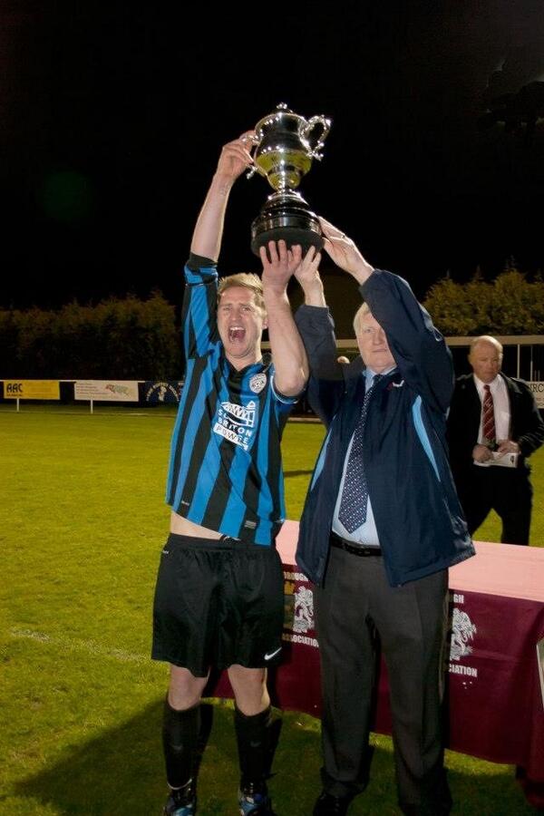 SuttonBridgeUFC's tweet photo. Captain Adam Fitch receiving the PFA Challenge Cup http://t.co/rQtkvdDfvv